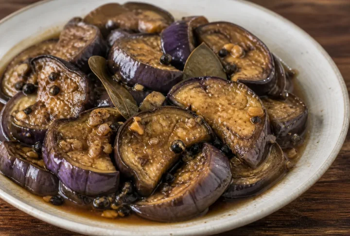 Vinegar pepper eggplant with garlic, bay leaves and black peppercorns