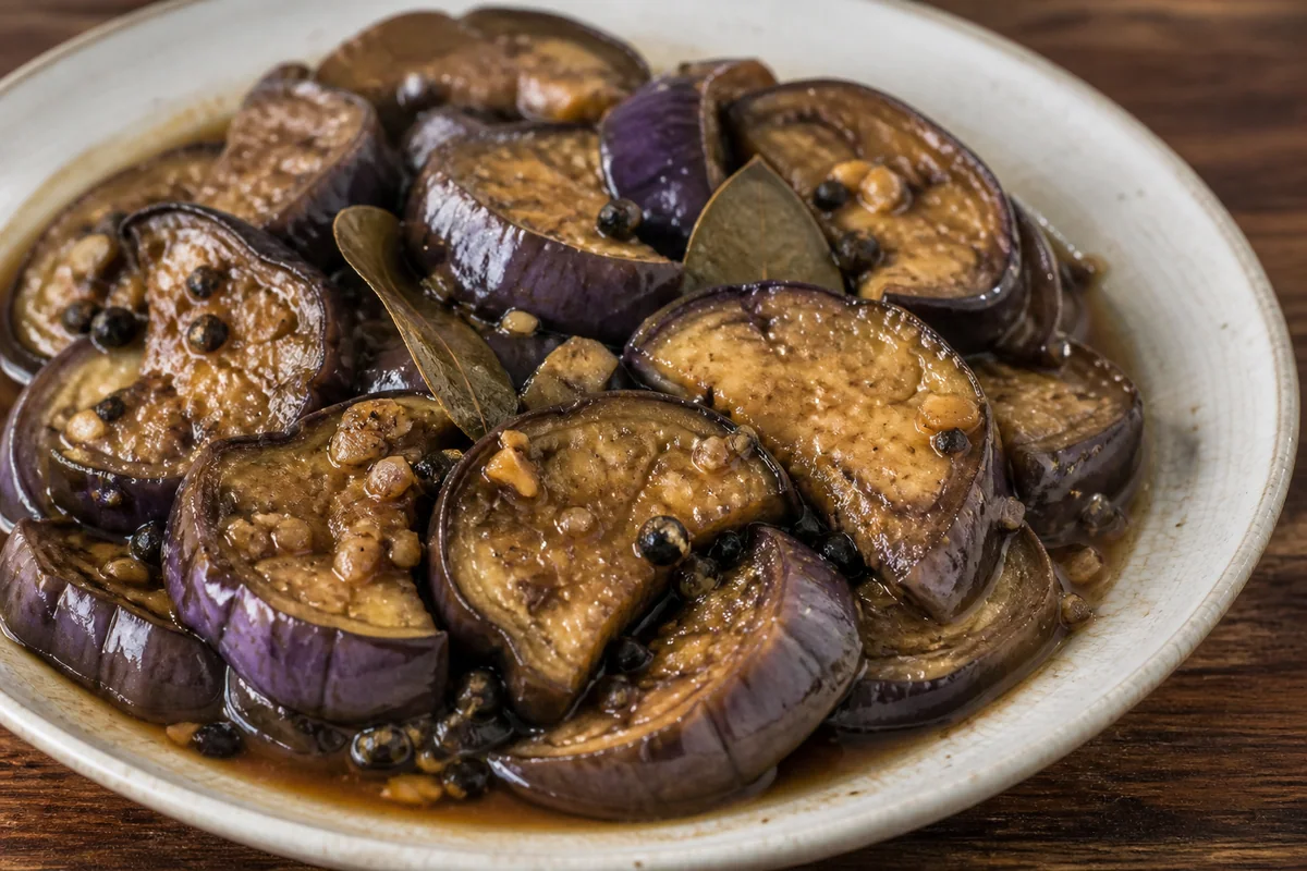 Vinegar pepper eggplant with garlic, bay leaves and black peppercorns